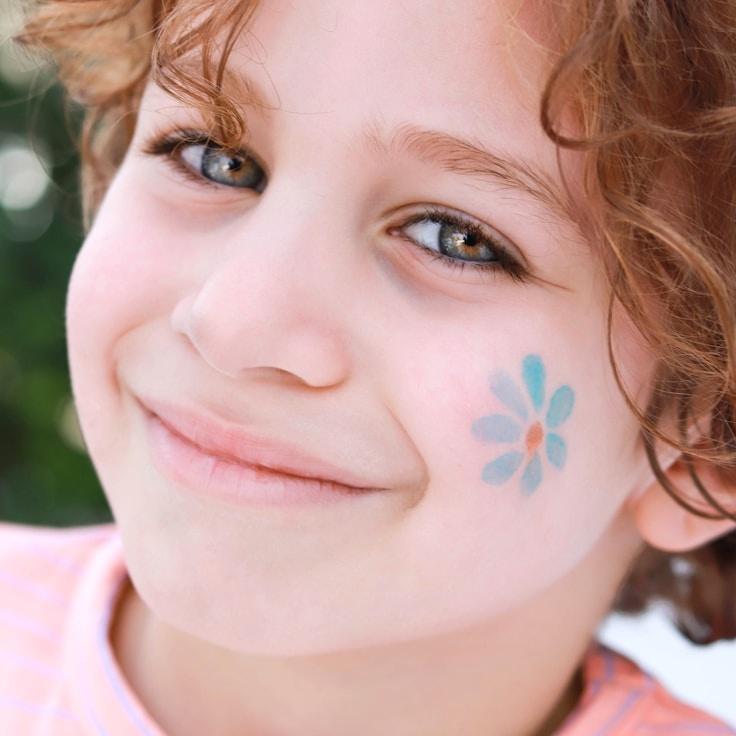 Kaveri Mehta, Lead Design Curator at EvenStreamCurrent, reviewing corporate floral arrangements